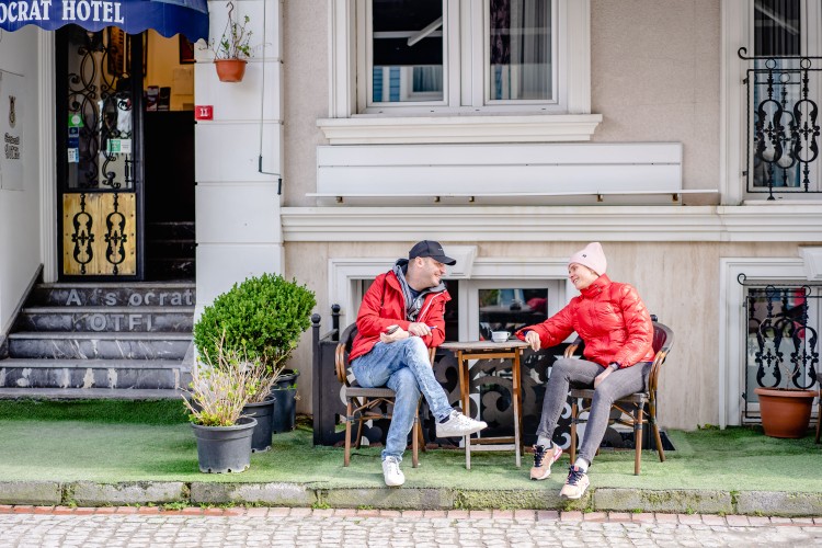 smiling-people-drinking-coffee-outside